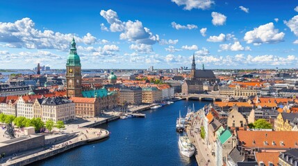 Obraz premium Vibrant Cityscape of Copenhagen with Historic Architecture, Blue Sky, and Calm Water Reflections