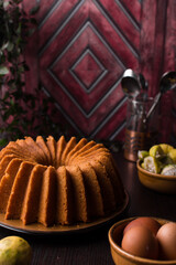 Lemon bundt cake on a wood countertop, citrus pound cake on wood background