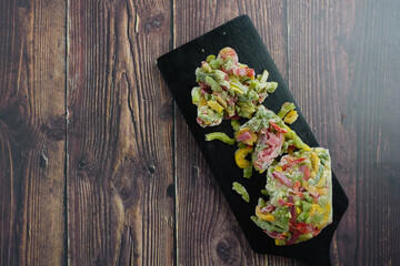 Colorful mixed frozen papers on table 