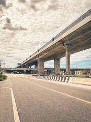 City street with trolleyway, showing modern urban transport and daily life in town. Clear road, electric trolley lines, and city atmosphere under bright daylight.