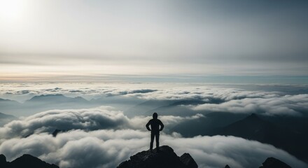 Man On Mountaintop Above Clouds At Sunrise