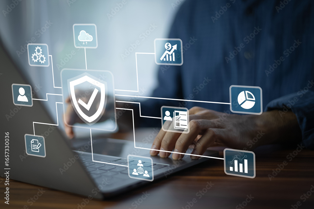 Aufkleber a business analyst working on a laptop monitors network security dashboards to detect risks in real 