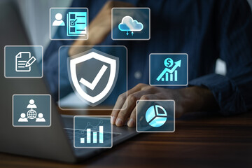 A professional sitting at a computer manages secure data protection and network security systems to prevent cyber threats. Security for Business data and Protection.