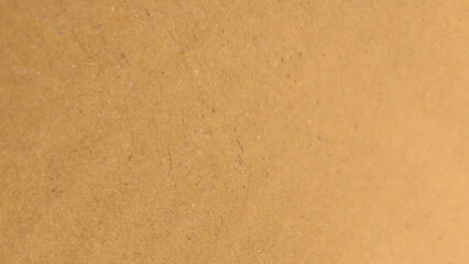 Background of brown kraft paper or cardboard texture. old paper sheet, parchment or papyrus surface.