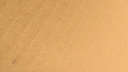 Background of brown kraft paper or cardboard texture. Abstract pattern of beige rough carton, old paper sheet.