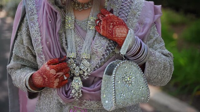 Bridal Mehndi and Jewelry Close-Up of Bride's Hands and jewelery during Outdoor Wedding Photoshoot 