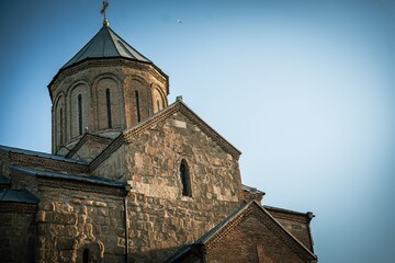 Fototapeta premium Scenic view of Metekhi Church with a dome under a clear blue sky in Georgia