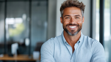 Obraz premium Smiling executive in modern office setting, showcasing confidence and professionalism