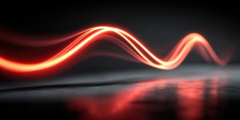 Abstract red light wave flowing over dark surface