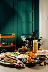 Ramadan Hari Raya Traditional Malay Dinner Gathering with Family and Friends in Malaysia with curry chicken, kumar, prawn, fish, ikan bakar, nasi briyani