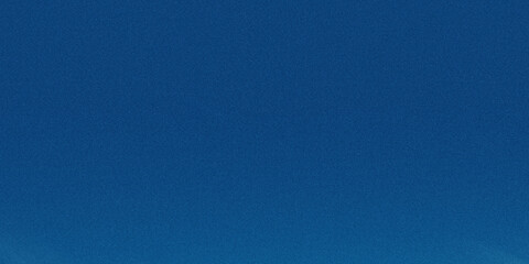 Naklejka premium A deep blue gradient background with a subtle grainy texture creates a calming and abstract visual effect