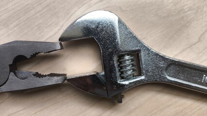 Construction and repair tools arranged on wood with text space. Great for equipment catalogs, handyman services, or visual industrial themes.