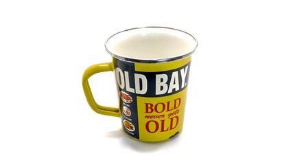 yellow mug with unique design with writing isolated on white background