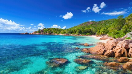 Serene Tropical Beach with Clear Blue Water and Lush Green Hills Under Bright Sunshine