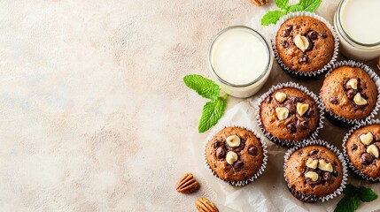 Delicious Chocolate Muffins with Nuts and Fresh Mint Leaves on a Rustic Background