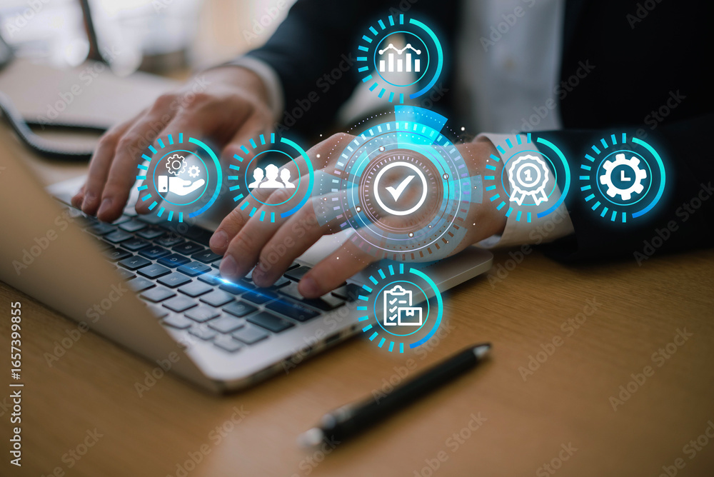 Poster hands typing on a laptop with digital icons representing business analytics and performance.