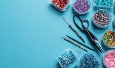 Colorful beads and jewelry-making tools arranged on a vibrant blue background for craft and accessory design