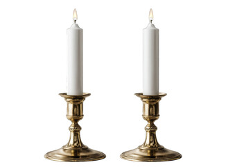 Two brass candle holders, white candles