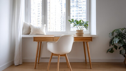 Modern home office desk with white chair and plant by a large window