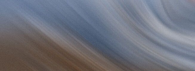 A blurred abstract background with a gradient texture creates a sense of motion and depth, featuring shades of blue and brown