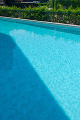 Empty swimming pool with table and chairs in summer,sofa resort neary sea and beach,restaurant and lunch,rest vacation concept.