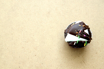 This dark brown brownie topped with chocolate and nuts makes it even more appetizing on the light...