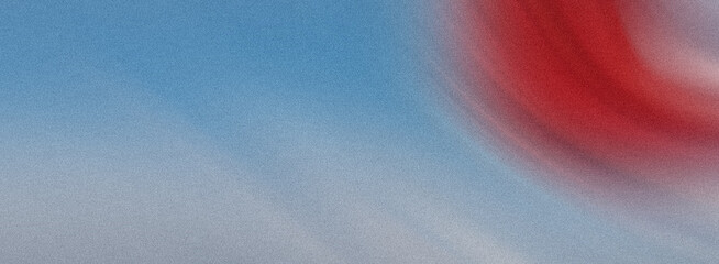 A textured blue background with a soft red gradient swirl creating a sense of depth and artistic...
