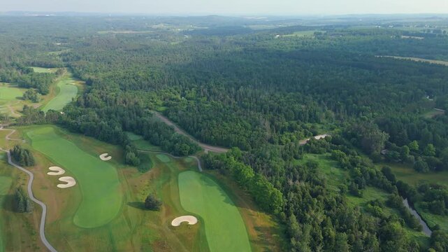 Manicured TPC golf course aerial with fairways and greens in Caledon, Ontario