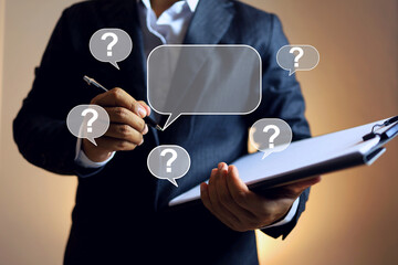 solution concept with businessman holding document clipboard and question mark floating around...
