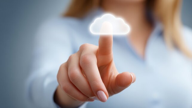 Professional businesswoman pointing at a floating cloud computing icon symbolizing data storage network services and modern information technology solutions for global connectivity.