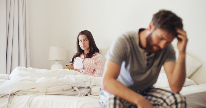 Frustrated woman, argument and conflict with stress in bed for cheating affair or disagreement. Upset, person or toxic relationship with phone in bedroom dispute for divorce or trust issues in home