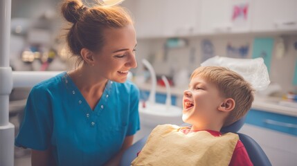 A dentist in colorful scrubs makes a funny face, making a young boy laugh while receiving dental care. The friendly atmosphere of the modern dentist office is highlighted by warm lighting,.