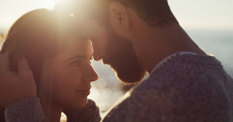 Couple, support and love with sunset on beach for summer vacation, romantic date and bonding. Happy, man and woman with travel, tropical holiday and affection for relationship and commitment at ocean