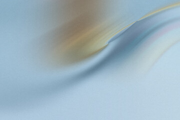 A smooth blue fabric drapes softly, creating a luxurious and elegant texture with subtle waves and a gentle gradient