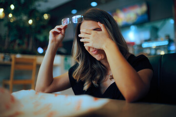 Woman Taking of her Glasses Feeling Overwhelmed and Tired. Unhappy lady feeling dizzy and exhausted...