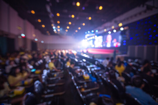 Blurred background of crown and speaker  in seminar room