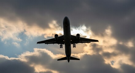 Airplane Silhouette Jet Soaring Through Dramatic Cloudy Skies at Sunset.