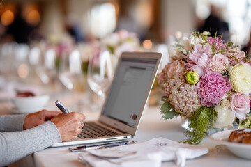 Fototapeta na wymiar Event planner coordinating a wedding venue