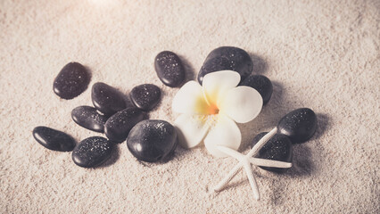 zen stones on sand beach