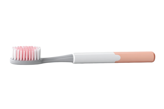 A light beige and peach-colored toothbrush.  The brush head is a light pink