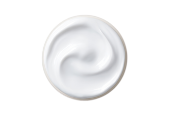 Creamy white cosmetic product swirls in a circular dish