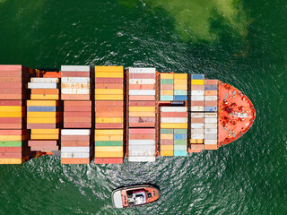 Shipping logistics. Commercial shipping. Top view. Cargo ship in sea, aerial view. Freight...