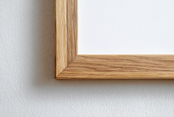 Naklejka premium Close-up of a wooden picture frame corner with a white background, emphasizing craftsmanship and design detail