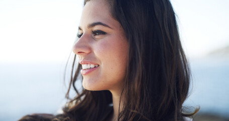 Thinking, woman and smile for travel at ocean for fresh air, summer ideas and vacation reflection. Happy, female person and thoughts with tourist planning, holiday memory and morning peace of getaway