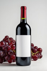Obraz premium Red wine bottle, blank label. Isolated for mockup, background.