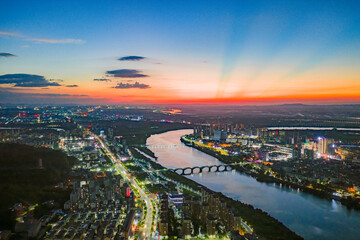 City power plant and large smokestacks at night