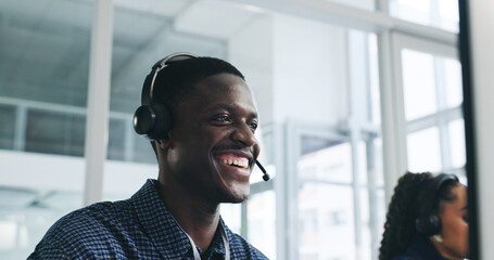 Smile, man and computer with headset at call centre for customer service, client inquiry and CRM....