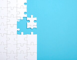 White puzzle pieces on a light blue background.  Missing piece