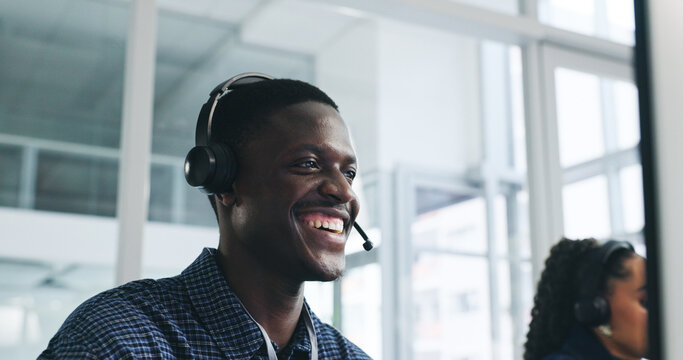 Smile, man and computer with headset at call centre for customer service, client inquiry and CRM. Happy, advisor and coworking with PC for help, telecom FAQ and information survey of online procedure