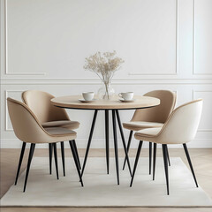 Beige dining chairs with black legs a round fabric and wood table in the middle of an empty room white walls a carpet on the floor a vase with coffee cup flowers a